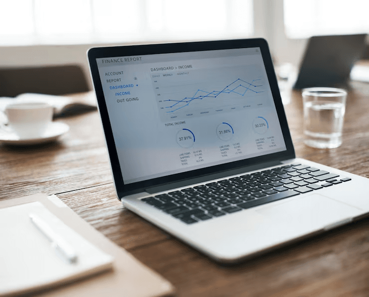 Analytics dashboard on laptop showing performance metrics and growth charts